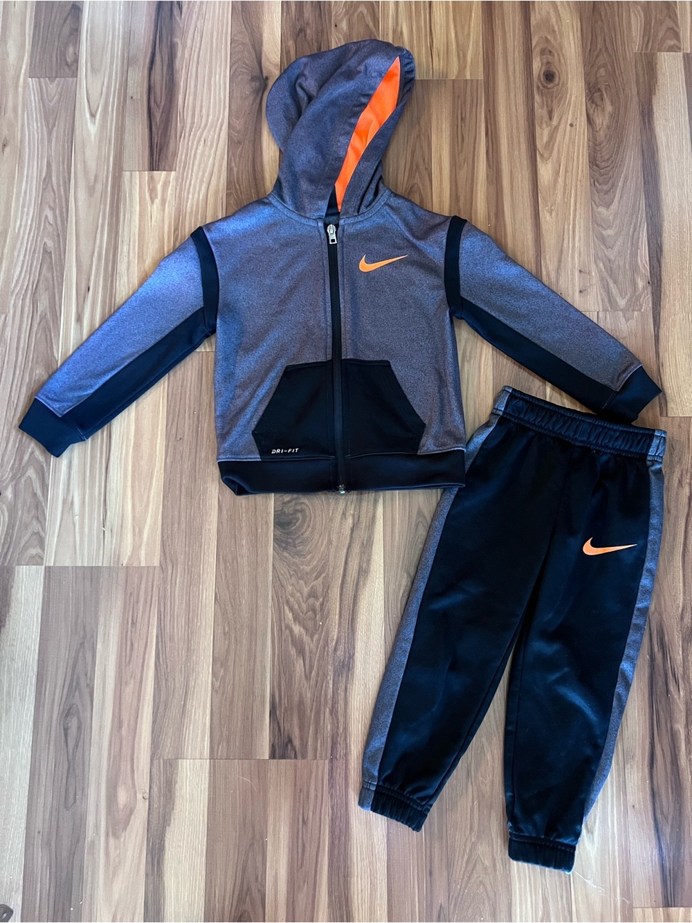 Nike Grey & Black Kids Hoodie and Joggers with Orange Swoosh